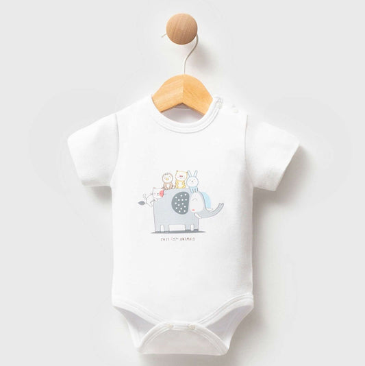 A white short-sleeve baby bodysuit hanging on a wooden hanger against a light gray background. The bodysuit features a cute graphic of a gray elephant carrying a baby carriage on its back, with the text 'ALL IS LOVING' printed below.